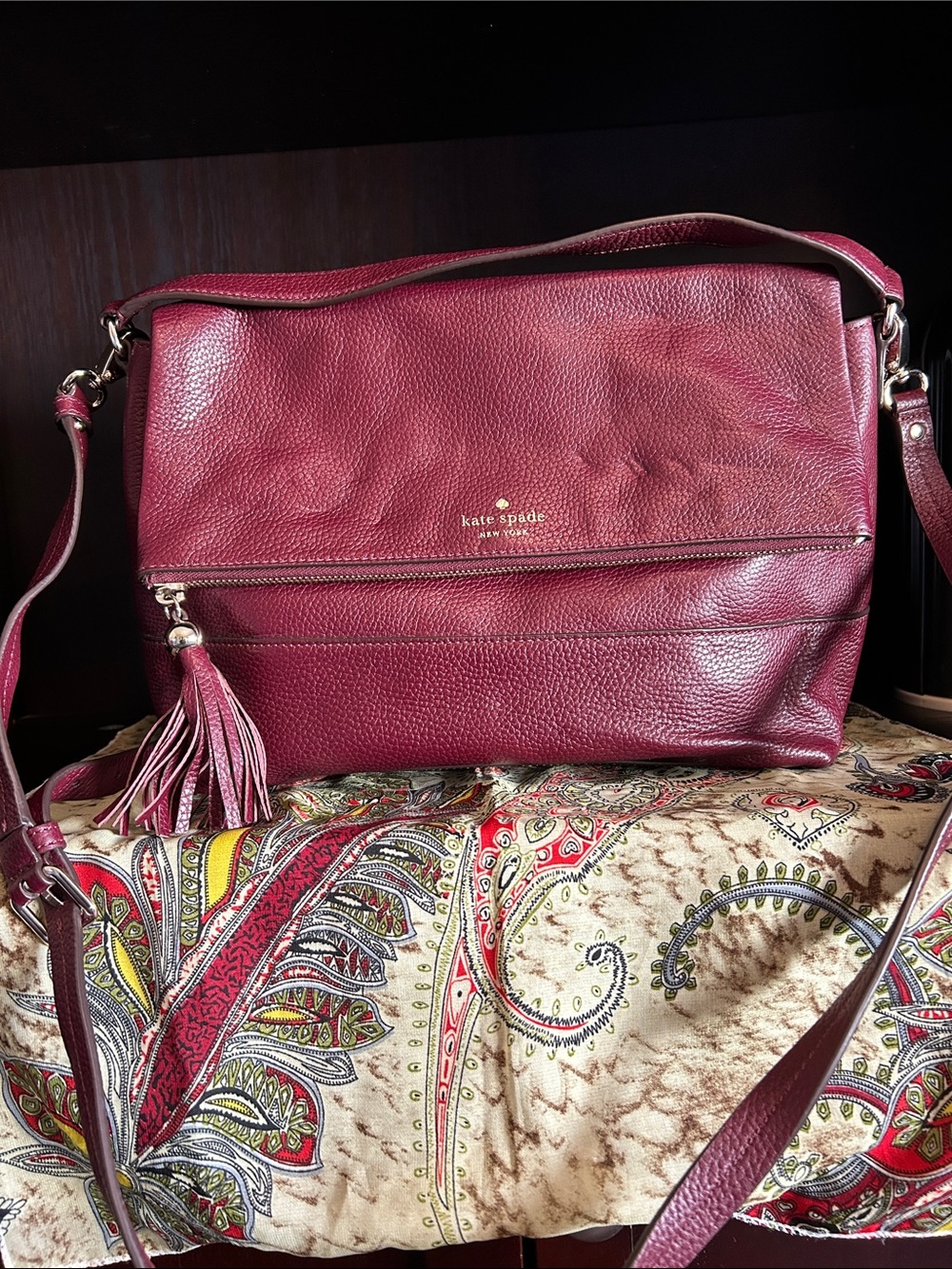 kate spade Pebbled Leather Crossbody in Deep Berry with Tassel
